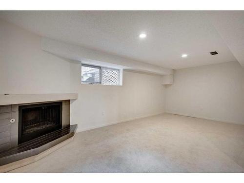 35-2225 Oakmoor Drive Sw, Calgary, AB - Indoor With Fireplace