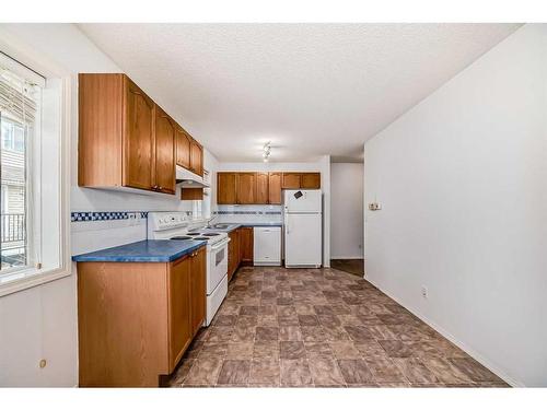 119 Arbour Lake Road, Calgary, AB - Indoor Photo Showing Kitchen With Double Sink