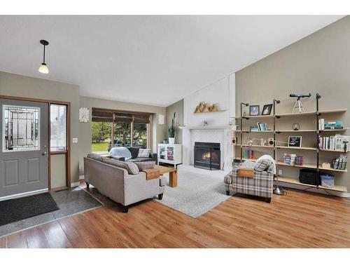 1006 2 Street Ne, Sundre, AB - Indoor Photo Showing Living Room With Fireplace