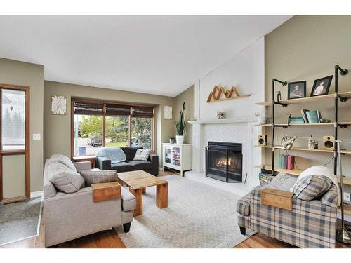 1006 2 Street Ne, Sundre, AB - Indoor Photo Showing Living Room With Fireplace