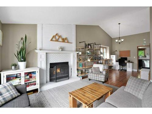 1006 2 Street Ne, Sundre, AB - Indoor Photo Showing Living Room With Fireplace