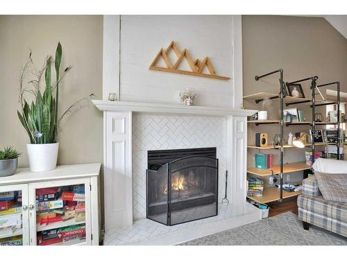 1006 2 Street Ne, Sundre, AB - Indoor Photo Showing Living Room With Fireplace