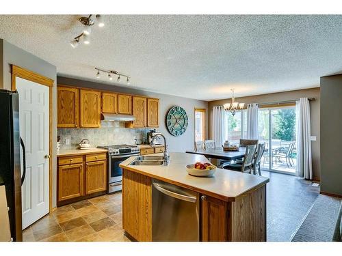 56 Valley Stream Circle Nw, Calgary, AB - Indoor Photo Showing Kitchen With Stainless Steel Kitchen With Double Sink