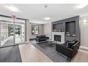 2305-73 Erin Woods Court Se, Calgary, AB  - Indoor With Fireplace 