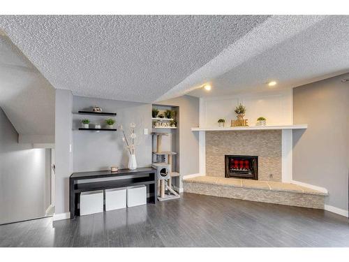 117 Hill Spring Meadows, Rural Rocky View County, AB - Indoor Photo Showing Living Room With Fireplace