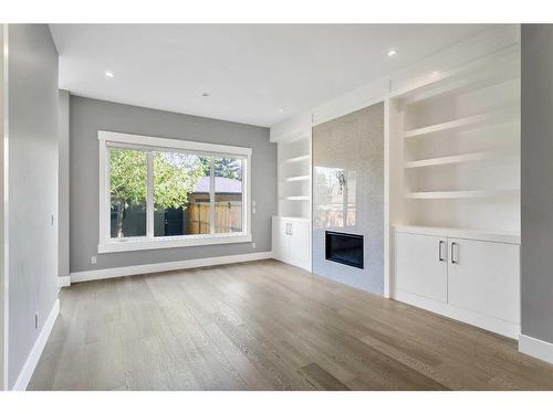 1838 18 Avenue Nw, Calgary, AB - Indoor Photo Showing Living Room With Fireplace