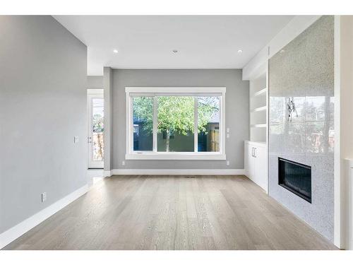 1838 18 Avenue Nw, Calgary, AB - Indoor Photo Showing Other Room With Fireplace