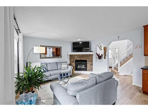 6 Cranwell Manor Se, Calgary, AB - Indoor Photo Showing Living Room With Fireplace