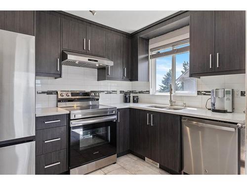 40 Falmere Court Ne, Calgary, AB - Indoor Photo Showing Kitchen With Stainless Steel Kitchen With Double Sink