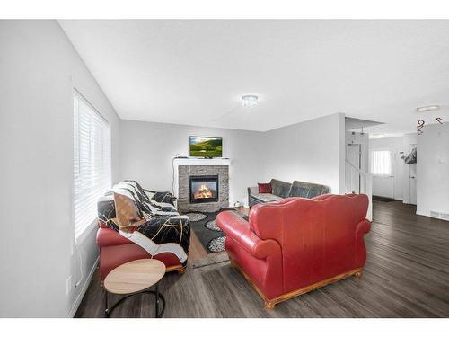 70 Saddlecrest Terrace Ne, Calgary, AB - Indoor Photo Showing Living Room With Fireplace