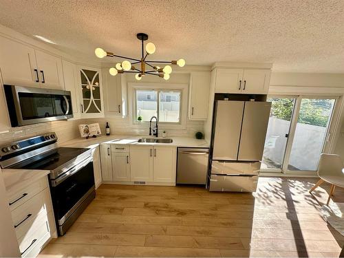 232 Deerpoint Se, Calgary, AB - Indoor Photo Showing Kitchen With Stainless Steel Kitchen With Double Sink