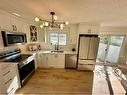 232 Deerpoint Se, Calgary, AB  - Indoor Photo Showing Kitchen With Stainless Steel Kitchen With Double Sink 