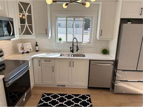 232 Deerpoint Se, Calgary, AB - Indoor Photo Showing Kitchen With Double Sink