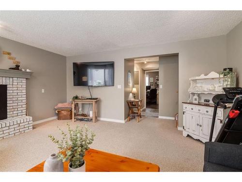 309 Sunvale Drive Se, Calgary, AB - Indoor Photo Showing Other Room With Fireplace