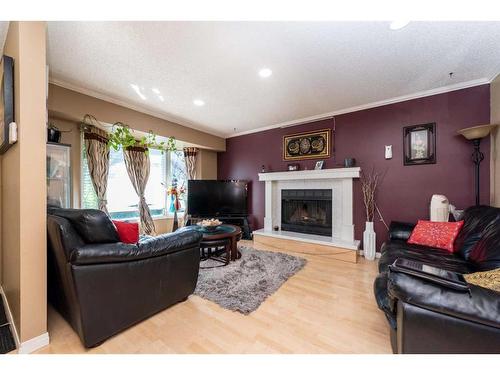 37 Edgeburn Crescent Nw, Calgary, AB - Indoor Photo Showing Living Room With Fireplace