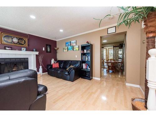 37 Edgeburn Crescent Nw, Calgary, AB - Indoor Photo Showing Living Room With Fireplace
