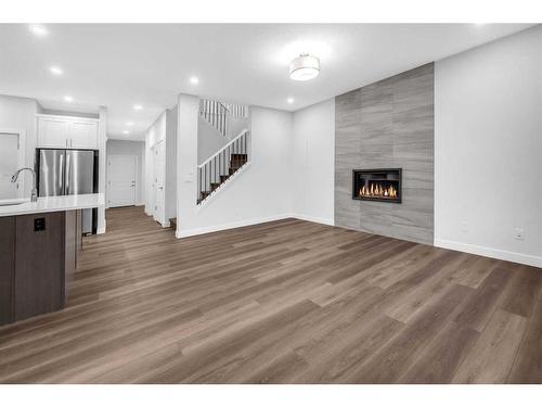 113 Creekside Way Sw, Calgary, AB - Indoor With Fireplace