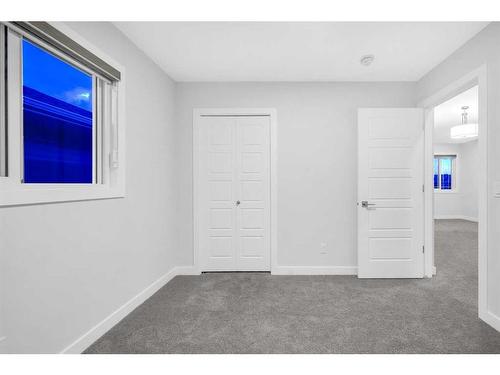 113 Creekside Way Sw, Calgary, AB - Indoor Photo Showing Other Room