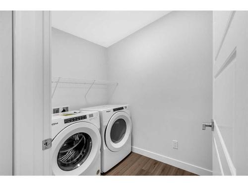 113 Creekside Way Sw, Calgary, AB - Indoor Photo Showing Laundry Room