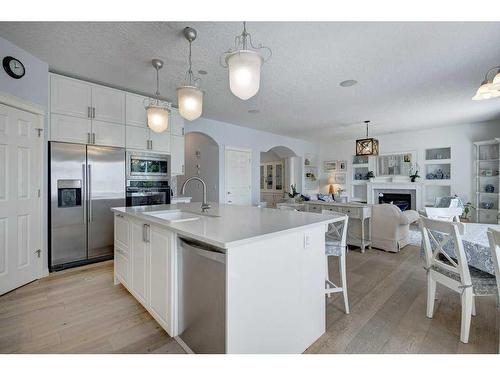 19 Crystal Shores Road, Okotoks, AB - Indoor Photo Showing Kitchen With Upgraded Kitchen