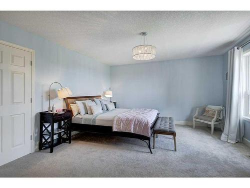 19 Crystal Shores Road, Okotoks, AB - Indoor Photo Showing Bedroom