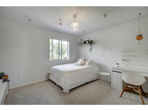 19 Crystal Shores Road, Okotoks, AB - Indoor Photo Showing Bedroom