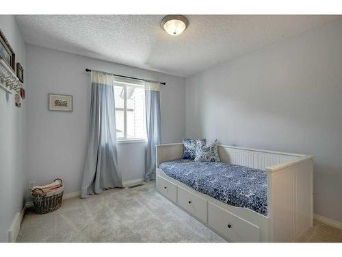 19 Crystal Shores Road, Okotoks, AB - Indoor Photo Showing Bedroom