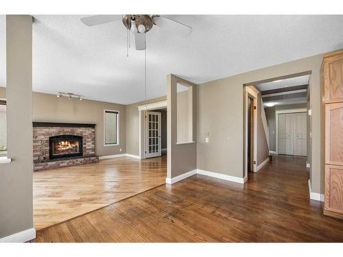 14216 Evergreen Street Sw, Calgary, AB - Indoor Photo Showing Living Room With Fireplace