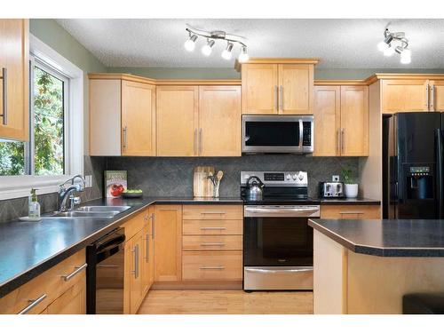 64 Ranchridge Way Nw, Calgary, AB - Indoor Photo Showing Kitchen With Double Sink