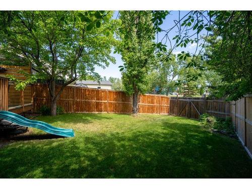 64 Ranchridge Way Nw, Calgary, AB - Outdoor With Backyard