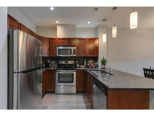 314-1899 45 Street Nw, Calgary, AB - Indoor Photo Showing Kitchen With Stainless Steel Kitchen