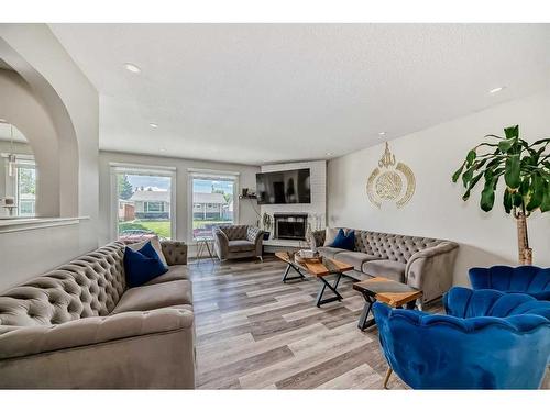 1708 65 Street Ne, Calgary, AB - Indoor Photo Showing Living Room With Fireplace