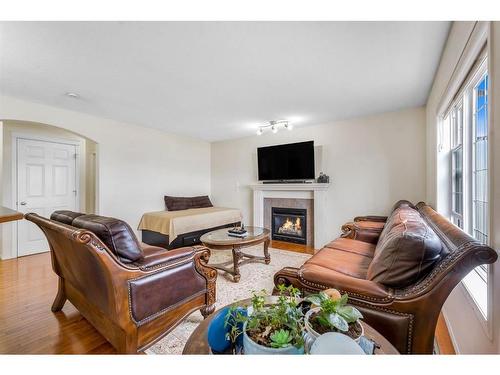 131 Tarawood Grove, Calgary, AB - Indoor Photo Showing Living Room With Fireplace