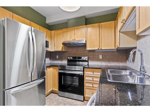319-8 Prestwick Pond Terrace Se, Calgary, AB - Indoor Photo Showing Kitchen With Double Sink