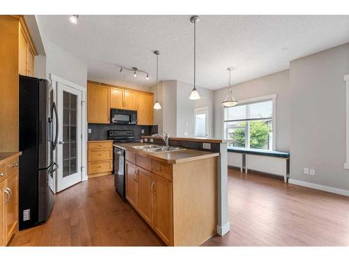 48 Elgin View Se, Calgary, AB - Indoor Photo Showing Kitchen With Double Sink