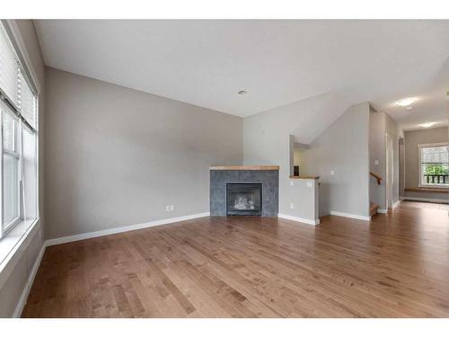 48 Elgin View Se, Calgary, AB - Indoor Photo Showing Living Room With Fireplace