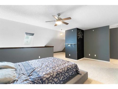 312-141 Mountain Street, Cochrane, AB - Indoor Photo Showing Bedroom