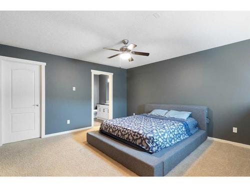 312-141 Mountain Street, Cochrane, AB - Indoor Photo Showing Bedroom