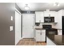 312-141 Mountain Street, Cochrane, AB  - Indoor Photo Showing Kitchen 