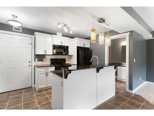 312-141 Mountain Street, Cochrane, AB - Indoor Photo Showing Kitchen