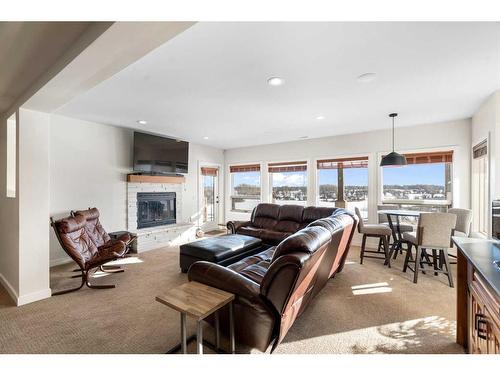 275114 Lochend Road, Rural Rocky View County, AB - Indoor Photo Showing Living Room With Fireplace