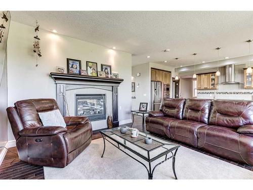 50 Sage Hill Way Nw, Calgary, AB - Indoor Photo Showing Living Room With Fireplace