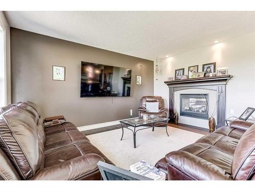 50 Sage Hill Way Nw, Calgary, AB - Indoor Photo Showing Living Room With Fireplace