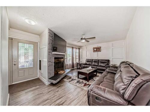 4611 Forman Crescent Se, Calgary, AB - Indoor Photo Showing Living Room With Fireplace