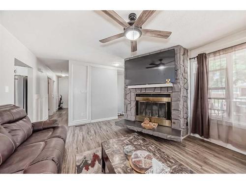 4611 Forman Crescent Se, Calgary, AB - Indoor Photo Showing Living Room With Fireplace