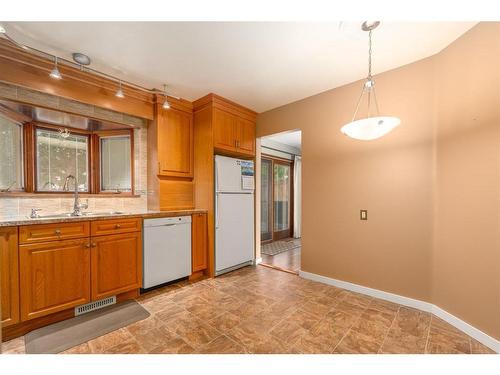 1012 Cannock Road Sw, Calgary, AB - Indoor Photo Showing Kitchen With Double Sink