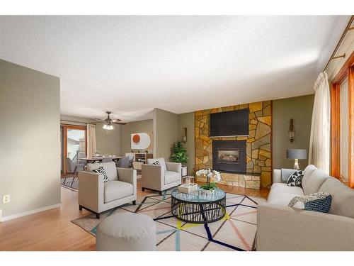 1012 Cannock Road Sw, Calgary, AB - Indoor Photo Showing Living Room With Fireplace