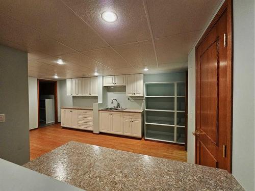 36 Bow Landing Nw, Calgary, AB - Indoor Photo Showing Kitchen With Double Sink