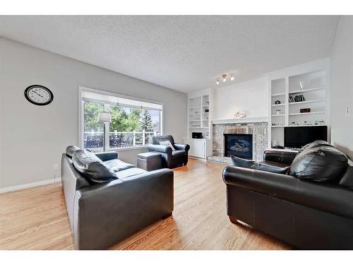 468 Mckenzie Lake Bay Se, Calgary, AB - Indoor Photo Showing Living Room With Fireplace
