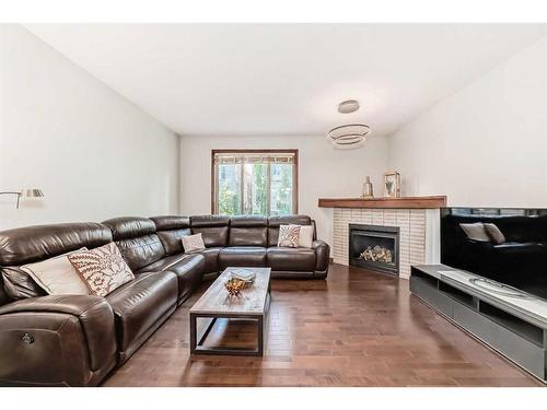 41 Everbrook Drive Sw, Calgary, AB - Indoor Photo Showing Living Room With Fireplace